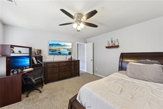 bedroom featuring ceiling fan, baseboards, visible vents, and light colored carpet