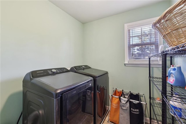 washroom with washing machine and dryer and laundry area