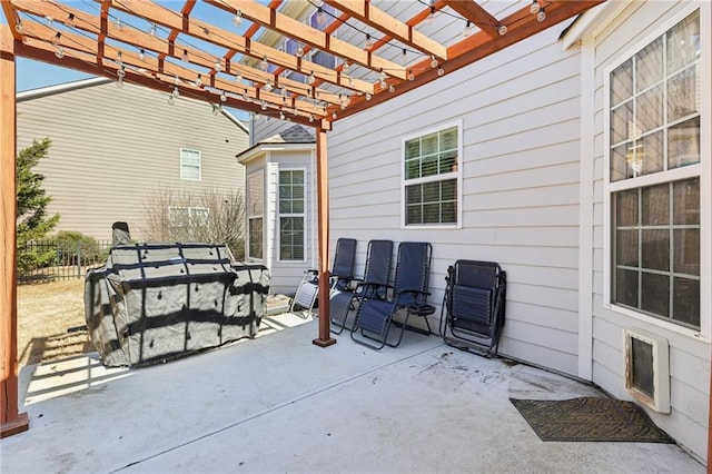 view of patio with fence and a pergola