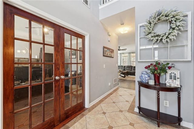 interior space featuring french doors, visible vents, baseboards, and tile patterned floors