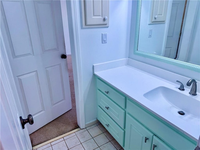 bathroom with tile patterned flooring and vanity