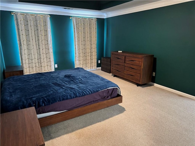 carpeted bedroom with ornamental molding