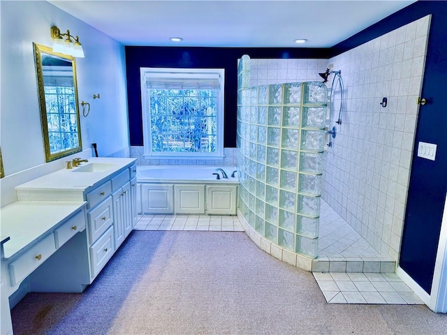 bathroom featuring tile patterned floors, vanity, and independent shower and bath