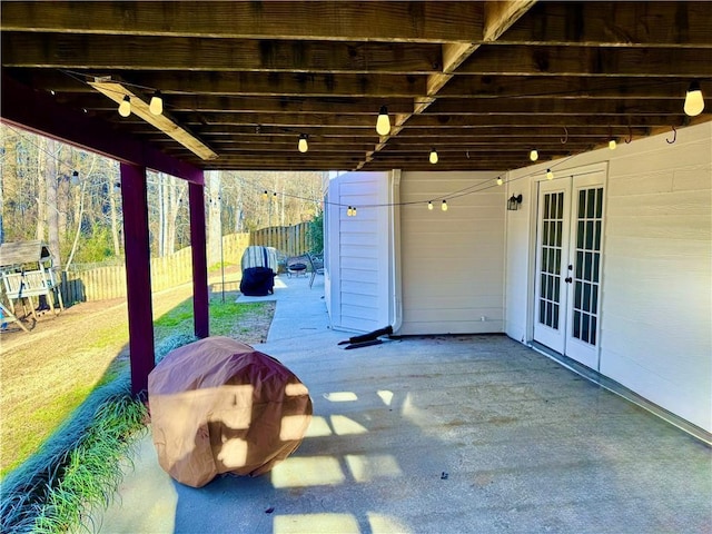 view of patio featuring a storage unit and french doors