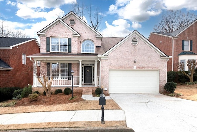 view of front of home with a garage and a porch