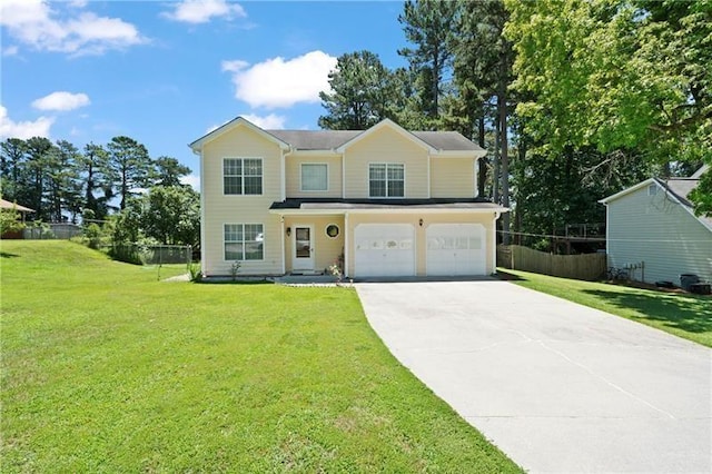 view of front of house featuring a garage and a front yard