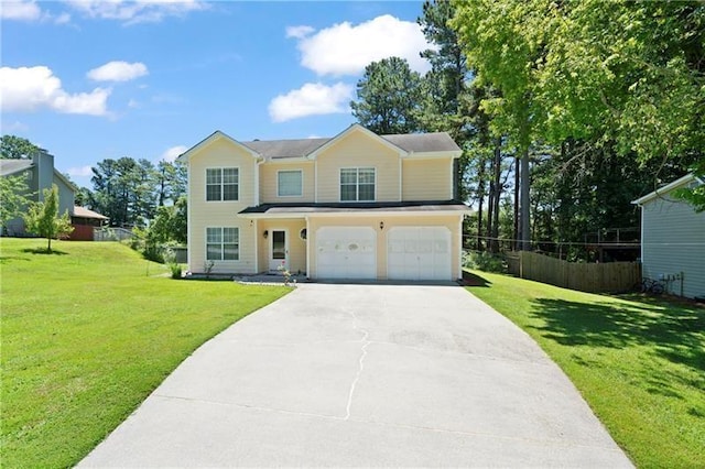 view of front of house with a garage and a front yard