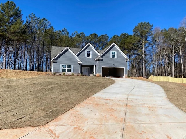 view of front of house featuring a garage and concrete driveway