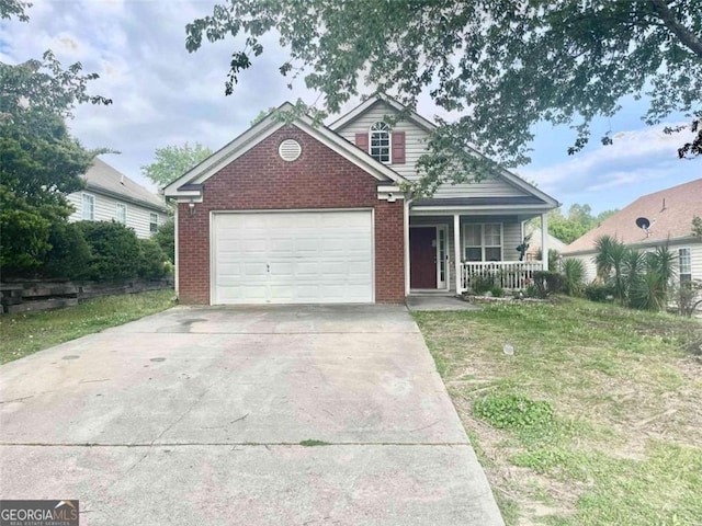 view of front of home featuring a garage, covered porch, and a front yard