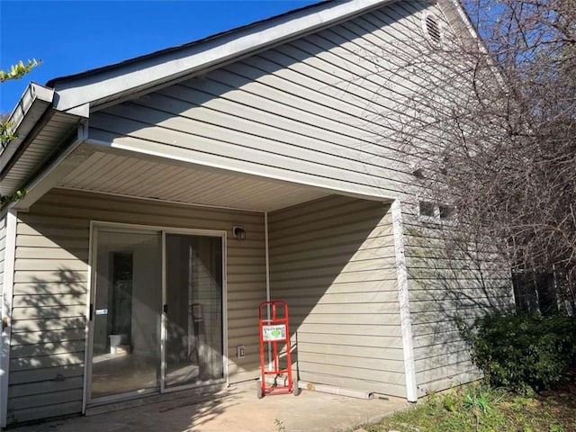 view of side of home featuring a patio area