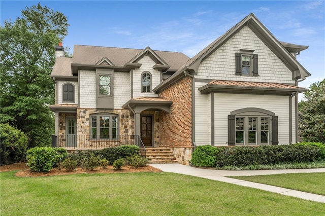 4823 Layfield Dr, Dunwoody, GA 30338 - view of front of property featuring a chimney, a front yard, a standing seam roof, and stone siding