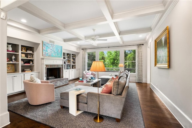4823 Layfield Dr, Dunwoody, GA 30338 - living area with ceiling fan, beamed ceiling, coffered ceiling, a brick fireplace, and baseboards