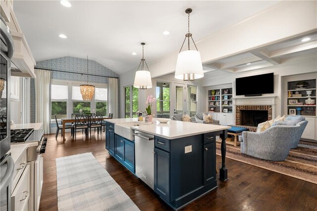 4823 Layfield Dr, Dunwoody, GA 30338 - kitchen with blue cabinets, stainless steel dishwasher, light countertops, a brick fireplace, and plenty of natural light