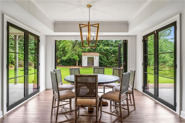 4823 Layfield Dr, Dunwoody, GA 30338 - dining area with french doors, a chandelier, wood finished floors, baseboards, and ornamental molding