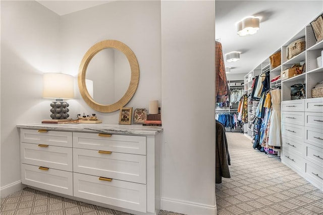 4823 Layfield Dr, Dunwoody, GA 30338 - walk in closet featuring light carpet