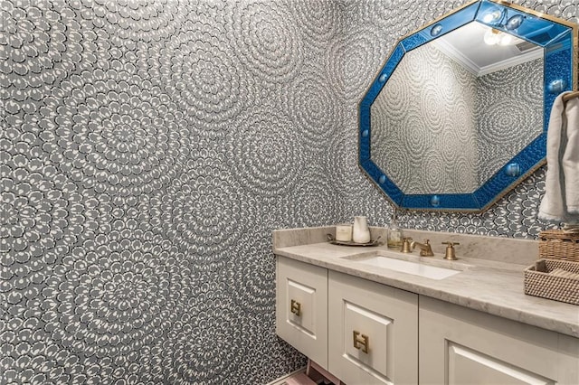 4823 Layfield Dr, Dunwoody, GA 30338 - bathroom with crown molding, vanity, and wallpapered walls