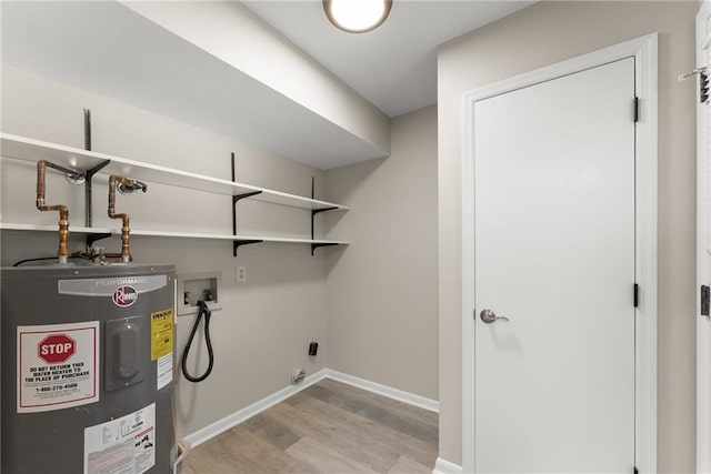 1292 Fernside Dr, Toccoa, GA 30577 - laundry room featuring electric water heater, hookup for a washing machine, light wood-style flooring, electric dryer hookup, and baseboards