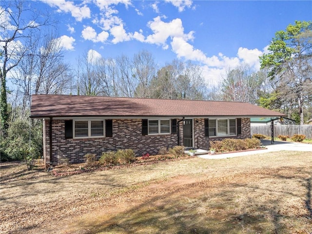 1292 Fernside Dr, Toccoa, GA 30577 - ranch-style home featuring concrete driveway, an attached carport, brick siding, and roof with shingles
