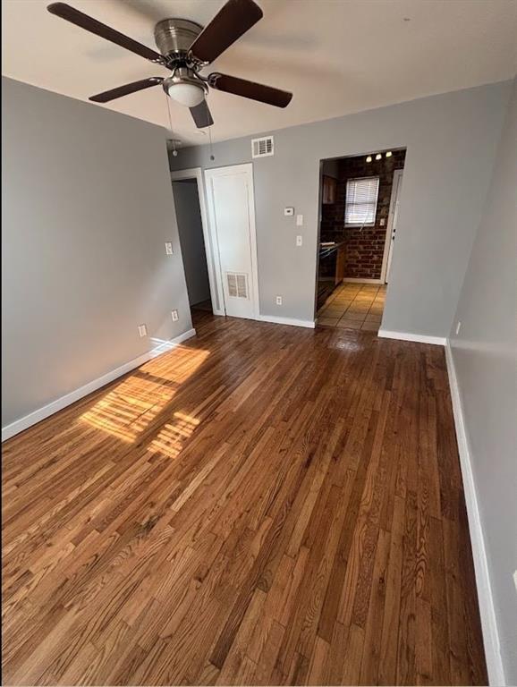 561 Formwalt St SW Unit 8, Atlanta, GA 30312 - spare room with wood-type flooring and ceiling fan