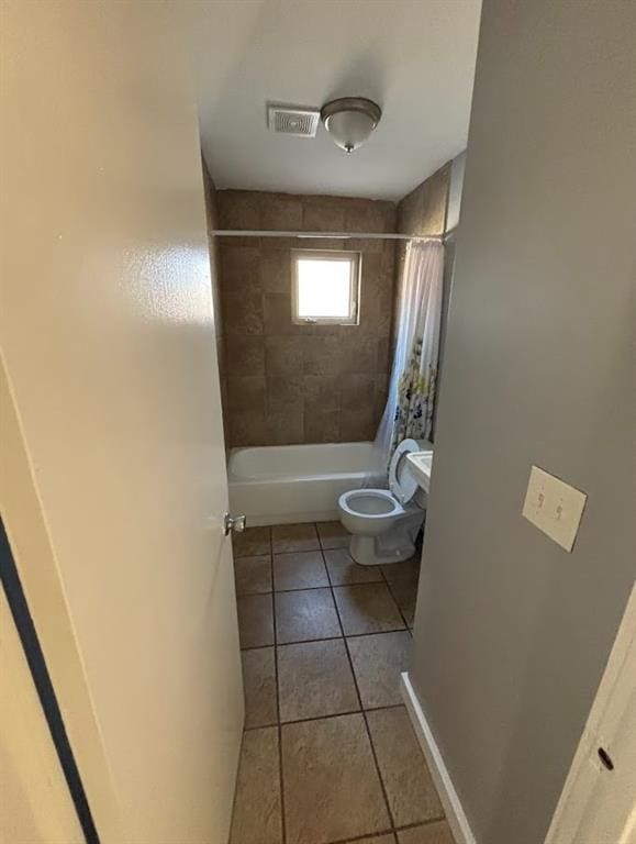 561 Formwalt St SW Unit 8, Atlanta, GA 30312 - bathroom featuring shower / bath combination with curtain, tile patterned floors, and toilet