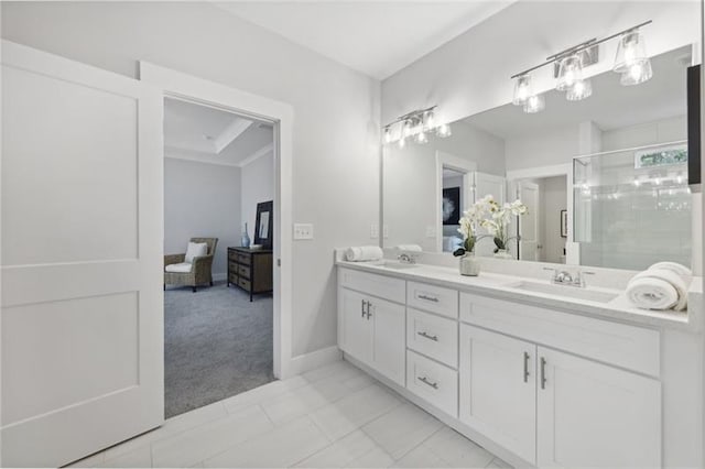 bathroom featuring vanity, a shower with shower door, and tile patterned floors