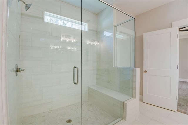 bathroom with tile patterned flooring and an enclosed shower