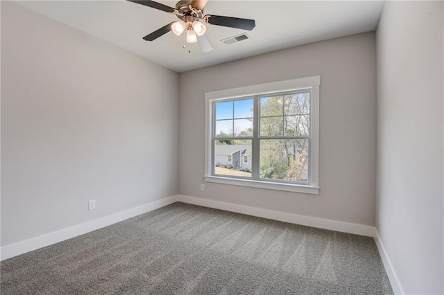 carpeted spare room with ceiling fan