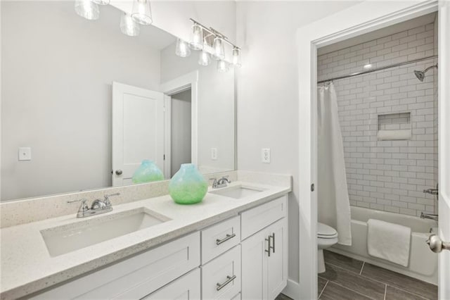 full bathroom with vanity, toilet, and shower / bath combination with curtain