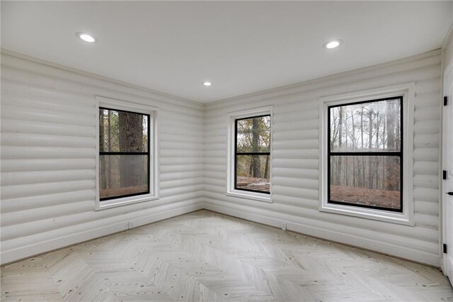 spare room with light parquet flooring