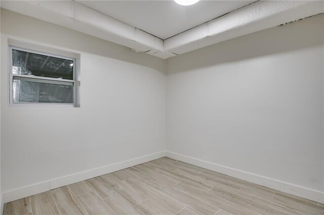 unfurnished room featuring light wood-type flooring