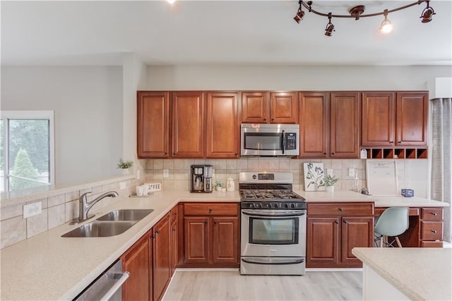 4092 Duran Ln, Auburn, GA 30011 - kitchen with stainless steel appliances, light countertops, and brown cabinetry