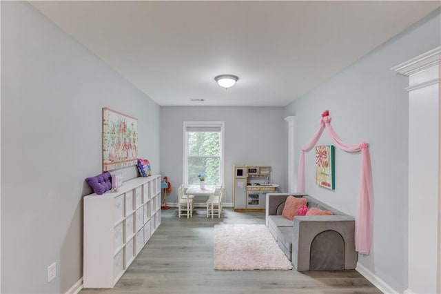 4092 Duran Ln, Auburn, GA 30011 - playroom with baseboards and wood finished floors
