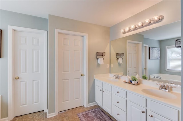 4092 Duran Ln, Auburn, GA 30011 - bathroom with double vanity, a garden tub, and tile patterned floors