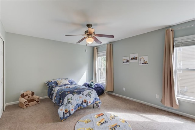4092 Duran Ln, Auburn, GA 30011 - carpeted bedroom with baseboards and ceiling fan