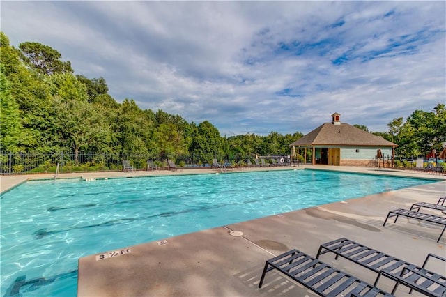 4092 Duran Ln, Auburn, GA 30011 - community pool with a patio area and view of wooded area