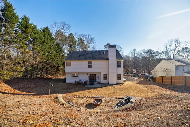 back of house with a patio