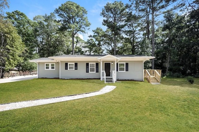 single story home featuring a front yard