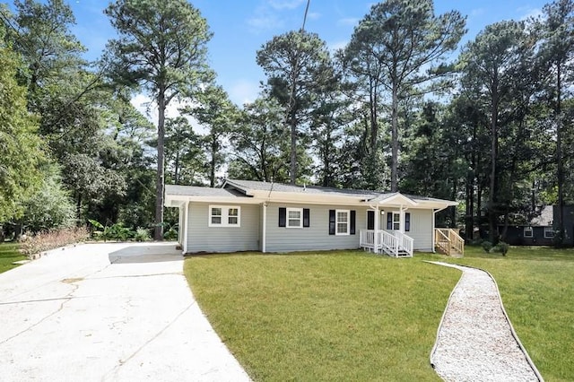 single story home featuring a front lawn