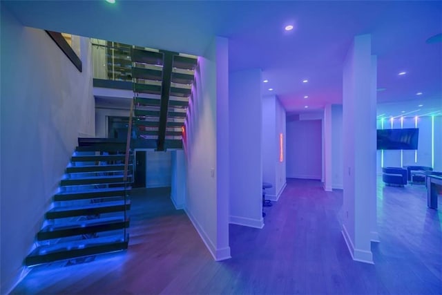 hallway with hardwood / wood-style floors