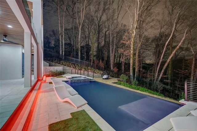 view of pool featuring an in ground hot tub and a patio