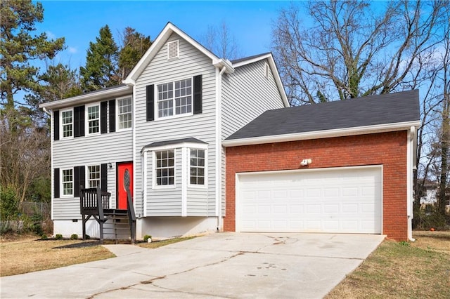 view of front of property featuring a garage and a front yard