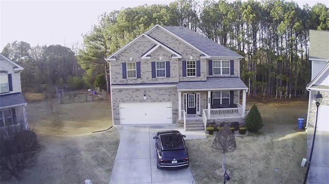 view of front of home featuring a garage and covered porch