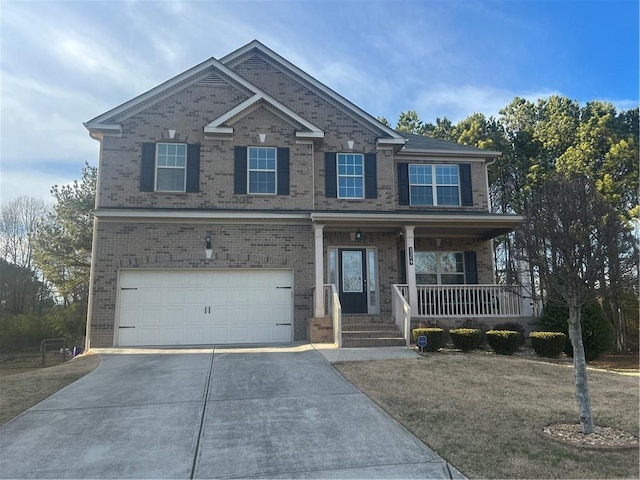 view of front of home featuring driveway and brick siding