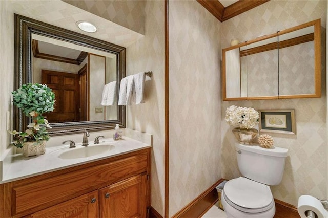 312 Crabapple Springs Way, Woodstock, GA 30188 - bathroom with baseboards, wallpapered walls, toilet, vanity, and ornamental molding