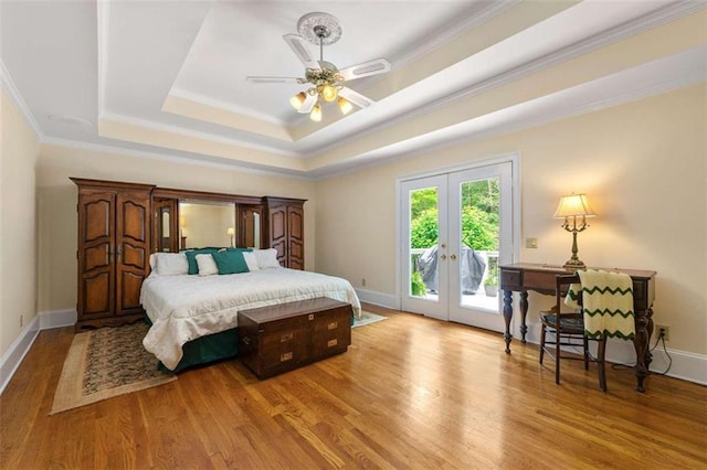 312 Crabapple Springs Way, Woodstock, GA 30188 - bedroom featuring access to outside, french doors, a raised ceiling, wood finished floors, and crown molding