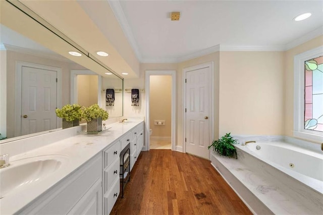 312 Crabapple Springs Way, Woodstock, GA 30188 - full bathroom featuring recessed lighting, a tub with jets, ornamental molding, wood finished floors, and double vanity