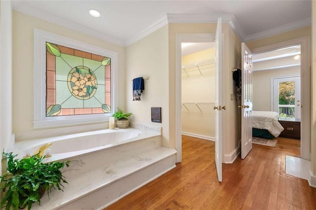 312 Crabapple Springs Way, Woodstock, GA 30188 - full bathroom with crown molding, wood finished floors, a bath, recessed lighting, and baseboards