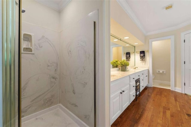 312 Crabapple Springs Way, Woodstock, GA 30188 - bathroom featuring crown molding, toilet, double vanity, wood finished floors, and recessed lighting