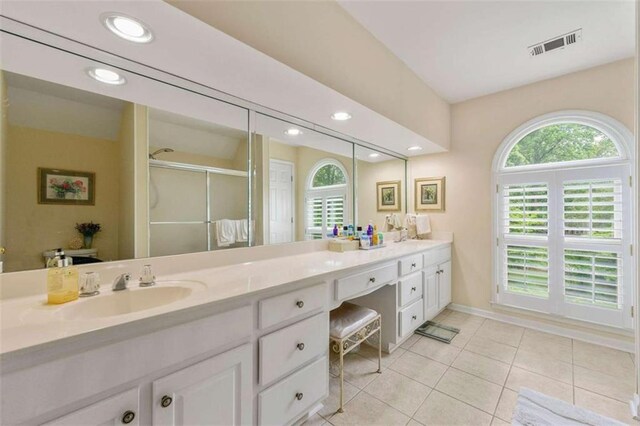 312 Crabapple Springs Way, Woodstock, GA 30188 - full bath featuring a shower stall, healthy amount of natural light, double vanity, tile patterned flooring, and recessed lighting