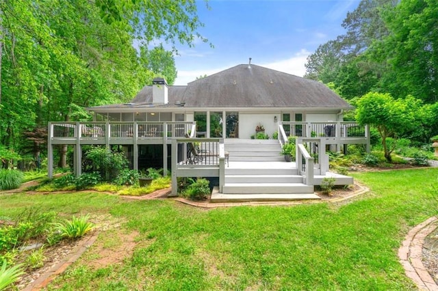 312 Crabapple Springs Way, Woodstock, GA 30188 - rear view of property with a lawn, a wooden deck, a chimney, and stairs